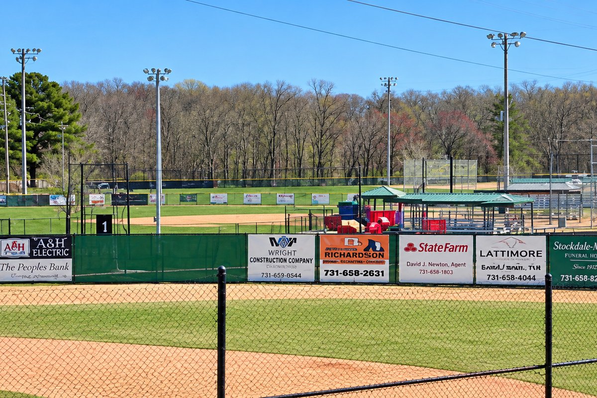 Baseball field with outfield fence advertising banners